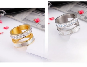 Detail of double-layer stainless steel rings with square crystals and white shell inlay