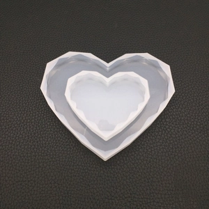 Macro detail of heart-shaped geometric silicone molds for DIY resin and candle casting