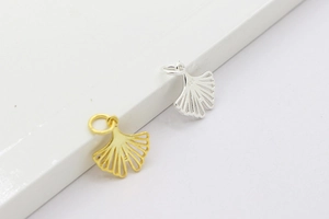 Detail of S925 sterling silver ginkgo leaf pendants in gold and silver finishes
