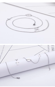 Detail showing silver titanium steel chain necklace with hollow cross pendants