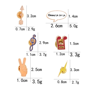 Set of colorful enamel pins including music notes, lightning bolts and peace hand signs