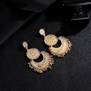 Retro bohemian moon and sun earrings with hollow engraving and golden tassels
