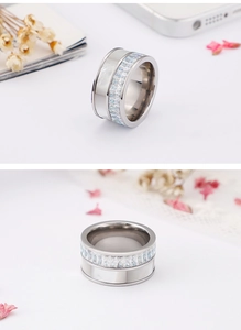 Detailed view of silver shell ring with rectangle zircons and polished finish