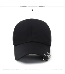Front view of black wool baseball cap with three silver metal rings on the brim