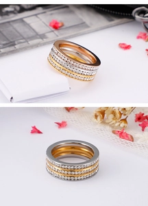 Close-up of triple band ring with pavé zircons in gold, rose gold and silver finishes