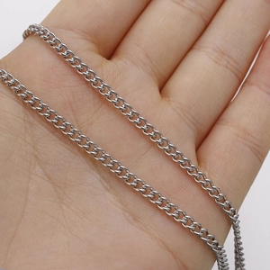 3mm stainless steel curb link chain necklace held for close-up view in silver tone