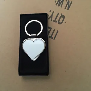 Silver heart-shaped metal keychain with sublimation insert in a premium black gift box