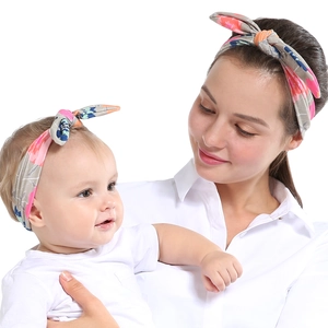 Floral print parent-child headband set in grey fabric with colorful flower patterns