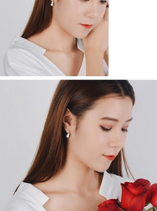 Macro close-up and lifestyle view of minimalist silver geometric drop earrings