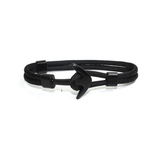 Close-up of black nautical rope bracelet featuring a polished metal anchor clasp buckle