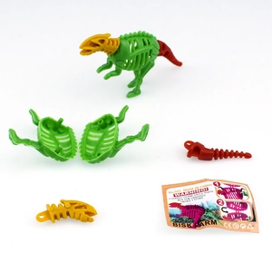 Close-up of DIY dinosaur skeleton toy with yellow, green, and red snap-together parts
