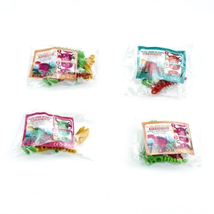Detail of DIY dinosaur skeleton toy parts in individual plastic packaging with instruction cards