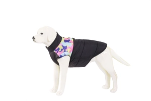 Close-up of winter dog vest featuring black quilted fabric and colorful camo print details