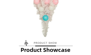Detail of pink and blue macaron ornaments on a white frosted Christmas teardrop swag