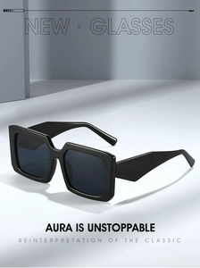 Detail of trendy square sunglasses with thick black frames and wide temples in modern style