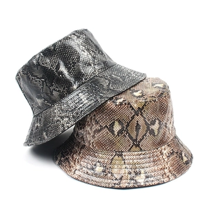Detail of PU snake skin pattern bucket hats in gray and brown with leather texture