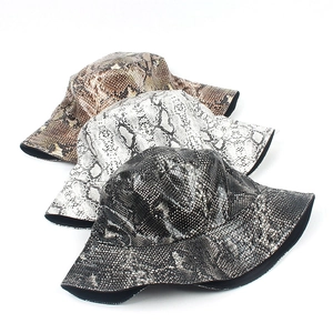 Trendy PU faux snake skin bucket hats in brown, grey and black displayed on white background
