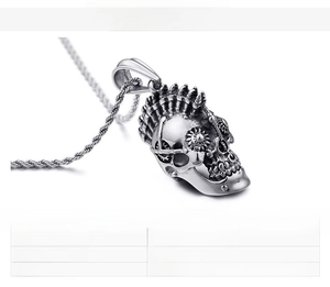 Detail of gothic stainless steel skull pendant with gear relief and 31g twist chain