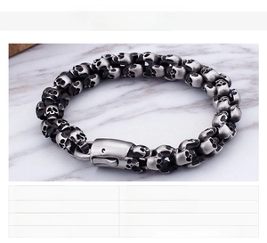 Detailed macro view of a 70g punk skull bracelet made of polished stainless steel