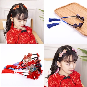 Detailed close-up of Chinese style floral headbands with traditional knots and tassels