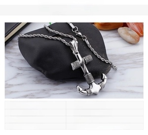 Detail view of 24g stainless steel anchor pendant with technical specifications table