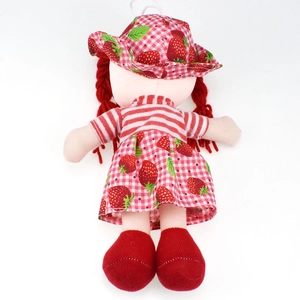 Back view of cute strawberry doll with red yarn braids and floral sun hat details