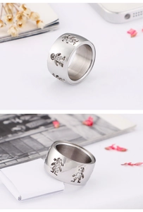 Detail view of silver stainless steel wide ring featuring hollow boy and girl silhouette