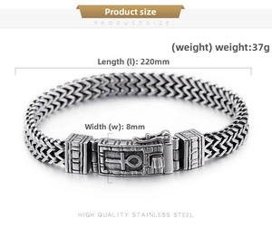 Macro detail of double-row stainless steel bracelet with Ankh symbol engraved clasp