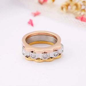 Three-tone stackable stainless steel rings with wave design and cubic zirconia inlays