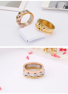 Three-piece stackable scalloped rings in gold, rose gold and silver with zircon stones