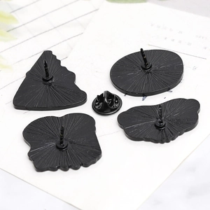 Back view of punk style alloy food brooches with butterfly clutches and metal texture
