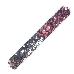 Macro detail of the reversible sequin slap bracelet with soft velvet lining