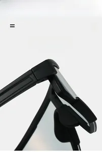 Close-up of matte black cycling glasses frame with reinforced metal hinges and super elastic material