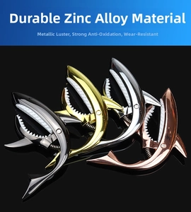 Shark-shaped guitar capos in four metallic finishes: black, gold, silver, and rose gold