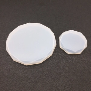 Macro detail of two round geometric silicone molds for DIY crystal resin casting projects