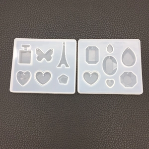 Dual set of silicone resin molds featuring Eiffel Tower, heart and floral pendant shapes