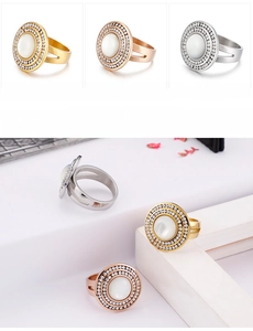 Detailed close-up of double-layered rhinestone rings with cat eye stones in gold and steel
