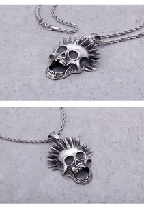 Macro shot of silver skull pendant with spikes and detailed punk textures on twist chain