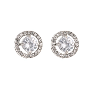Macro detail of silver halo stud earrings with round-cut zircon and claw setting
