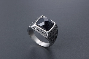 Detailed side view of silver titanium men's ring with blue sandstone and Greek key pattern