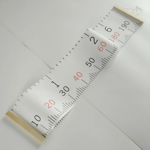 Detail of wooden hanging canvas growth chart with printed scale up to 190 cm for kids