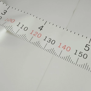 Macro shot of canvas growth chart scales showing metric and imperial measurements