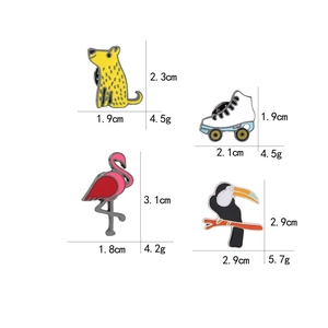 Enamel cartoon brooches including flamingo and roller skate with size dimensions