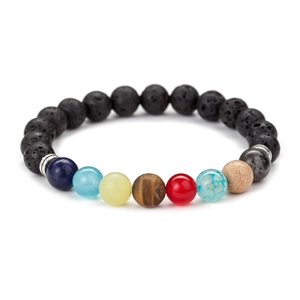 Detailed macro view of 8mm lava rock beads and seven chakra natural stones on bracelet