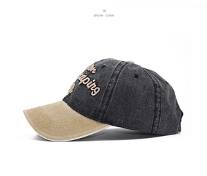 Detail of vintage washed cotton baseball cap with side embroidery and contrast brim
