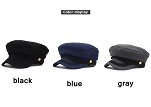 Detailed view of wool newsboy caps in black, blue, and gray with decorative braided straps