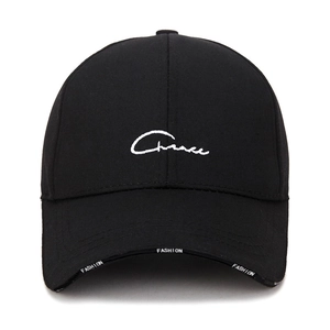Black cotton baseball cap with white signature embroidery and fashion brim detail