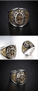 Detailed close-up of vintage USN anchor ring in stainless steel with gold relief