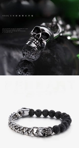 Detail of men's punk skull bracelet with black lava stones and stainless steel chain