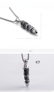 Detail view of 70mm vintage dragon-engraved bullet pendant in stainless steel